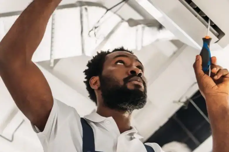 Belcarra Mechanical technician installing a new furnace system in a modern home